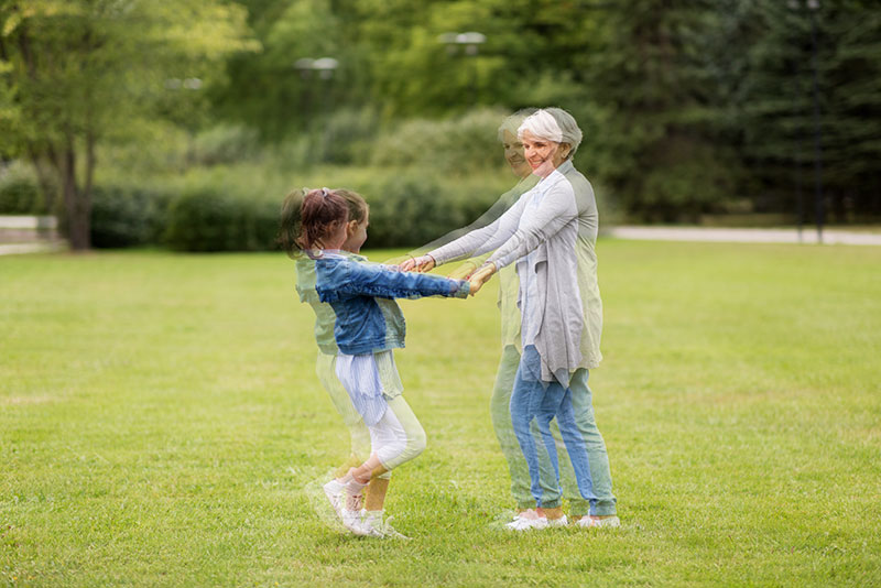 Image of Grandmother and Grandaughter dancing with double vision